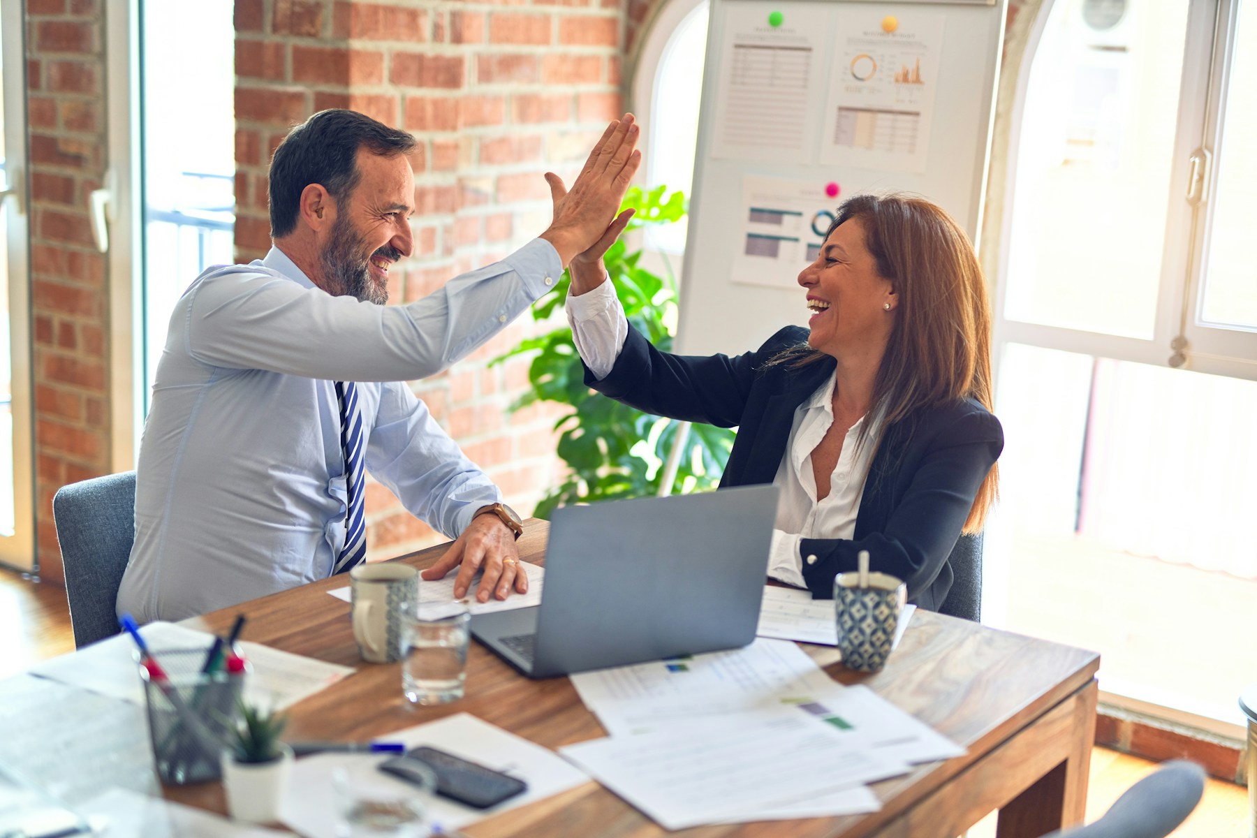 Professionals coordinating workforce solutions